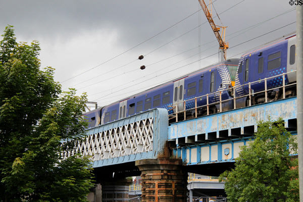 Commuter train on bridge over Kelvin River. Glasgow, Scotland.