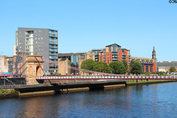 Clyde River in core with triumphal arch pylon of Clyde & South Portland footbridge against modern structures. Glasgow, Scotland.