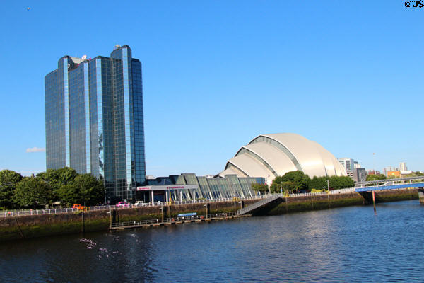 Crowne Plaza tower & Armadillo on Clyde River. Glasgow, Scotland.