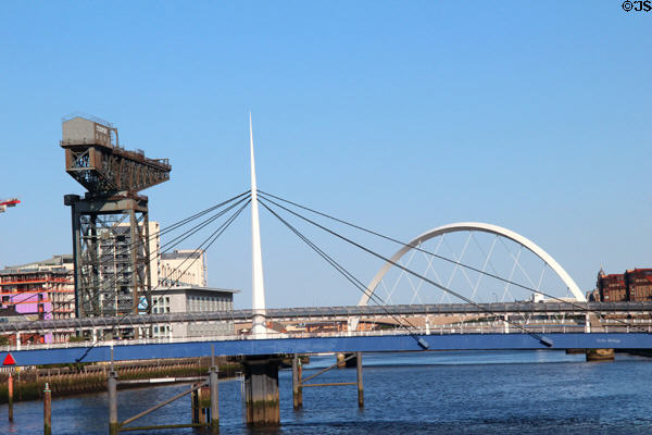 Bells Bridge (1988) with white spike erected for Glasgow Garden Festival with Clydeport crane & Glasgow Arc bridge (2002) beyond. Glasgow, Scotland. Architect: Crouch & Hogg.
