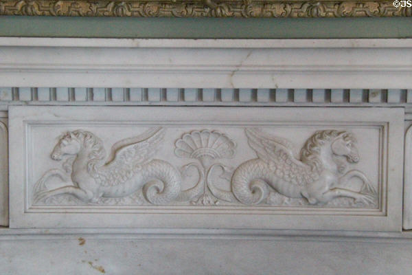 Carved seahorses mantle piece on fireplace in round drawing room by Robert Adam at Culzean Castle. Maybole, Scotland.