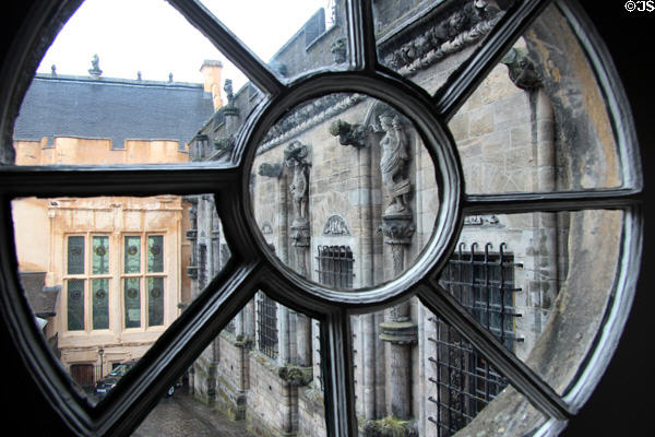 Carvings on Palace seen through window at Stirling Castle. Stirling, Scotland.