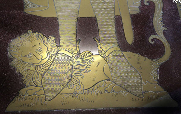 Detail of bronze lion under feet of King Robert the Bruce tomb marker in Dunfermline New Abbey Church. Dunfermline, Scotland.