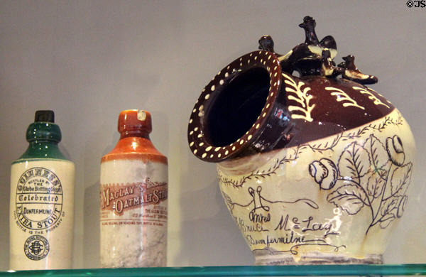 Stoneware stout bottles & ceramic salt pig at Dunfermline Carnegie Library Museum. Dunfermline, Scotland.