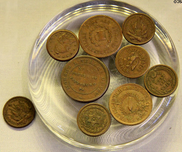 U.S. Civil War token coins (c1862) minted by private companies to offset shortage of U.S. government minted cents at Andrew Carnegie Birthplace Museum. Dunfermline, Scotland.