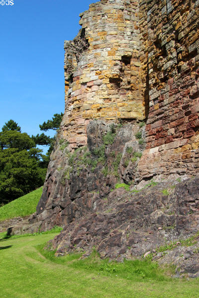 Stones rise from rocks at Dirleton Castle. Dirleton, Scotland.