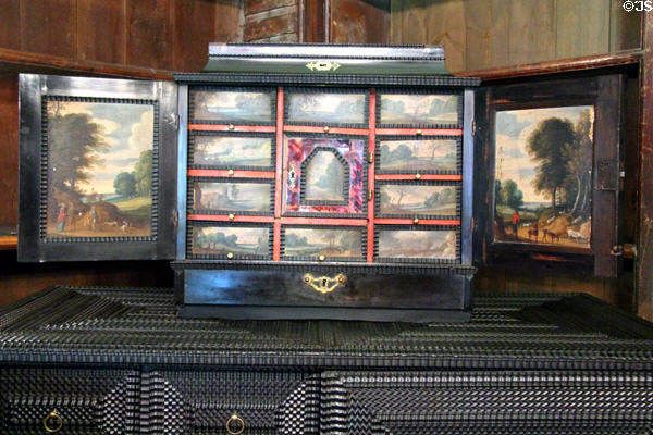 Finely carved Dutch ebony chest with landscape scenes painted on interior doors & drawers in Library at Newhailes. Musselburgh, Scotland.