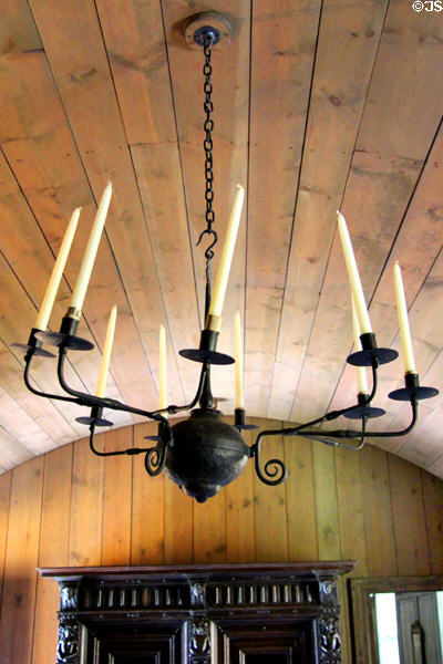 Wrought iron chandelier hanging from barrel vaulted pine ceiling in High Hall at Culross Palace. Culross, Scotland.