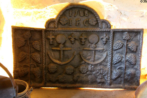 Cast iron fire back inscribed IFC (1588) with anchors in High Hall at Culross Palace. Culross, Scotland.