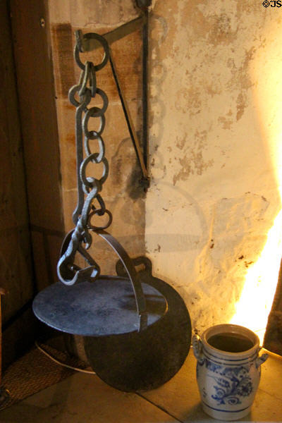 Cast iron girdle (griddle) hanging from sway marks time when Culross had Royal Warrant for monopoly on making wrought iron girdles in High Hall at Culross Palace. Culross, Scotland.