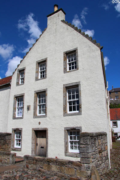 Heritage house with three-story facade with crowsteps roofline. Culross, Scotland.