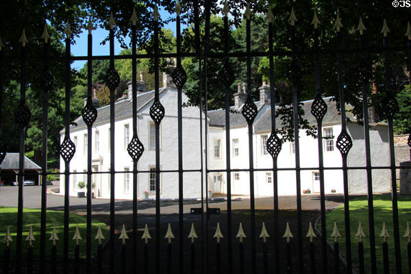 Balgownie Mansion House (with parts dating from 18thC) & ironwork fence. Culross, Scotland.
