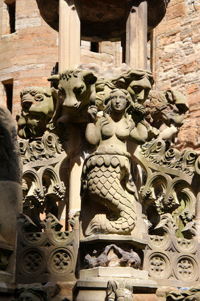 Mermaid among carved heads on Linlithgow Palace fountain. Linlithgow, Scotland.
