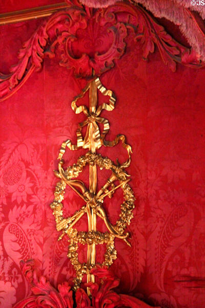 Gilded medallion on headboard of four poster bed in State Bedchamber at Hopetoun House. Queensferry, Scotland.