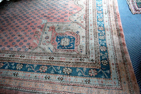 Persian pink & blue carpet in dining room at Lauriston Castle. Edinburgh, Scotland.