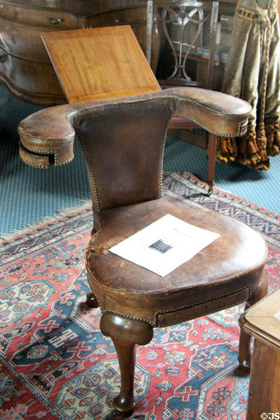 Reversible reading chair with drawers for glasses, pens & paper in library at Lauriston Castle. Edinburgh, Scotland.