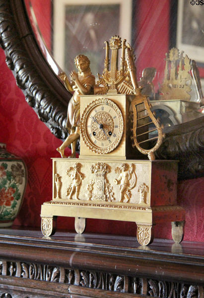 Ornate mantel clock with mythological theme in library at Lauriston Castle. Edinburgh, Scotland.
