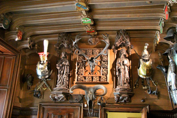 Wood work hung with arms in entrance hall at Abbotsford House. Melrose, Scotland.