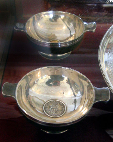 Pair of silver quaiches (1808) each embedded with coin from the 1500s at Abbotsford House. Melrose, Scotland.