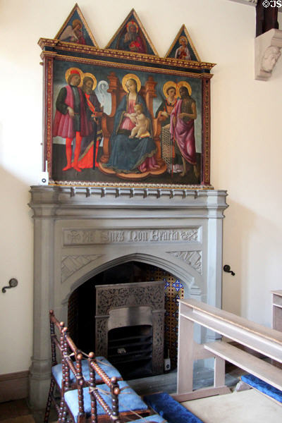 Madonna & child with saints painting over gothic fireplace in chapel at Abbotsford House. Melrose, Scotland.