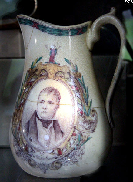 Pottery jug (c1840) with face of Sir Walter Scott at museum of Abbotsford House. Melrose, Scotland.