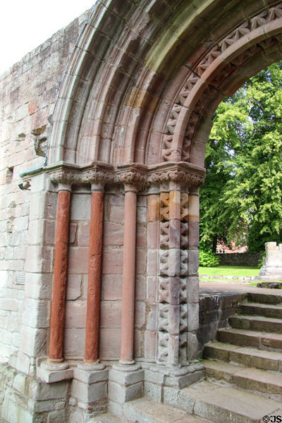 Carved Romanesque east processional doorway arch (late 12thC) at Dryburgh Abbey. Scotland.