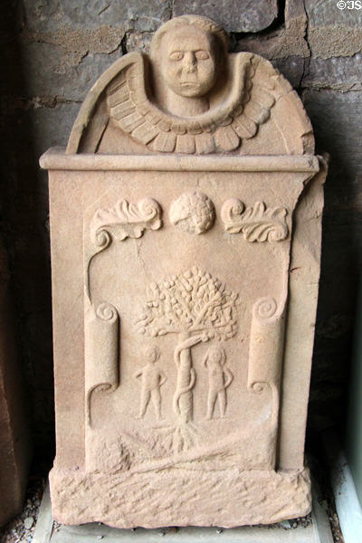Tombstone (18thC) with Adam & Eve in Garden of Eden at Dryburgh Abbey. Scotland.