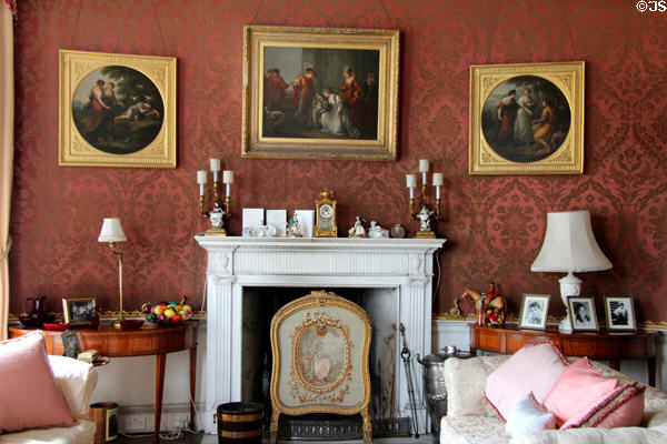 Fireplace with paintings in morning room at Manderston House. Duns, Scotland.