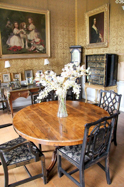Round table with Chinese Chippendale chairs in tea room at Manderston House. Duns, Scotland.