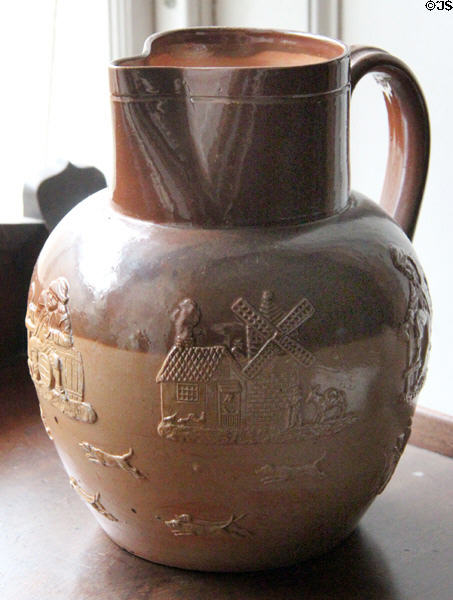 Brown ceramic pitcher embossed with windmill by Royal Doulton at Manderston House. Duns, Scotland.