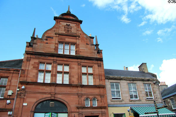 Red sandstone Bank of Scotland (1897) on north side of Melrose Market Square. Melrose, Scotland. Architect: George Washington Browne.