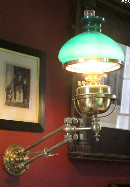 Wall mounted converted oil lamp at Thirlestane Castle. Scotland.