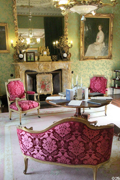 French Empire style seating before large drawing room fireplace at Thirlestane Castle. Scotland.