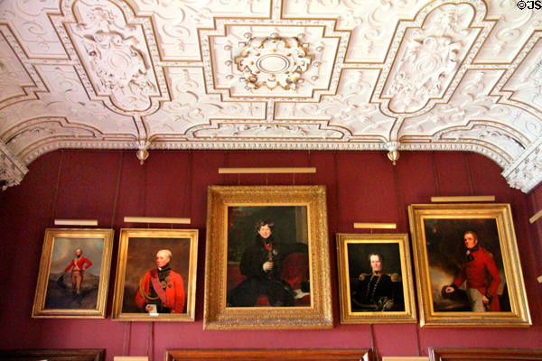 Family portraits in dining room at Thirlestane Castle. Scotland.