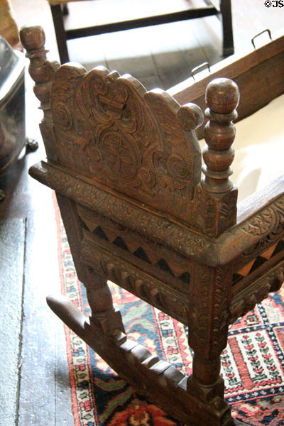 Carving detail on cradle used by Mary Queen of Scots for her baby son King James VI of Scotland at Traquair House. Scotland.
