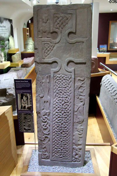 Pictish cross-slab (front Droston stone) shows devils & monsters being crushed by power of cross at St Vigeans Museum. Arbroath, Scotland.