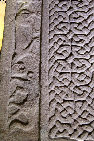 Pictish Droston stone front detail of lace of cross beside carved birds at St Vigeans Museum. Arbroath, Scotland.