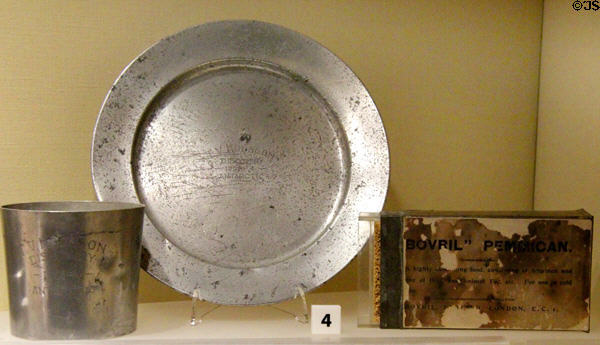 Aluminum cup & plate + Bovril Pemmican (1901) used on Antarctic expedition at RRS Discovery Museum. Dundee, Scotland.