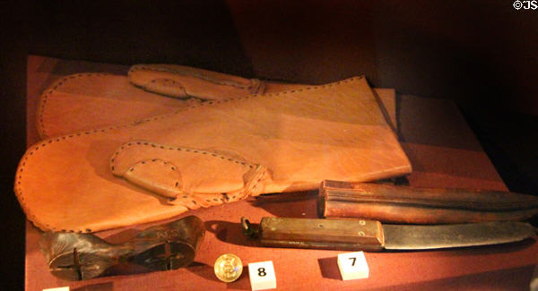 Leather mittens, snow goggles, button & sheath knife belonging to Captain Scott & others (1901-4) at RRS Discovery Museum. Dundee, Scotland.