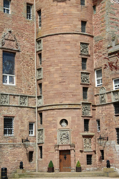 Entrance to spiral staircase tower covered with family crests at Glamis Castle. Angus, Scotland.