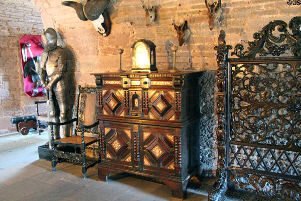 Armor, chest-on-chest & Victor fire screen in crypt at Glamis Castle. Angus, Scotland.