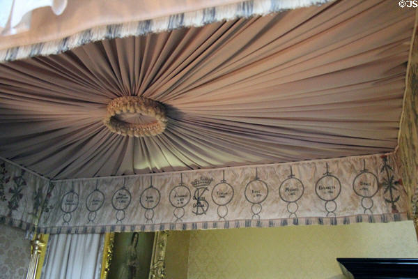 Bed canopy embroidered by Cecilia Bowes-Lyon with names of her ten children including Queen Mother Elizabeth in Queen Mother's bedroom at Glamis Castle. Angus, Scotland.