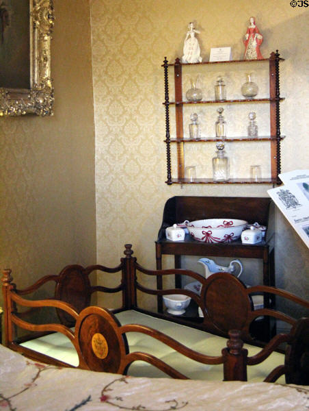 Washstand & cradle in Queen Mother's bedroom at Glamis Castle. Angus, Scotland.
