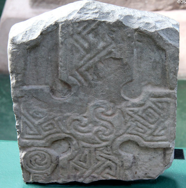 Pictish grave stone (front of #3) with tri-lobed locking waves in centre of cross at Meigle Sculptured Stone Museum. Meigle, Scotland.