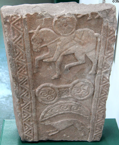 Pictish cross-slab (back of #6) with horseman over spiral-filled double disc & crescent & hound at Meigle Sculptured Stone Museum. Meigle, Scotland.