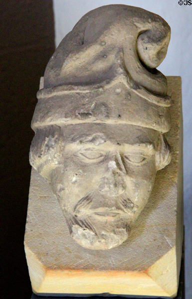 Stone corbel carved in shape of head with cap (prob. 15thC) in museum at St Andrews Cathedral. St Andrews, Scotland.