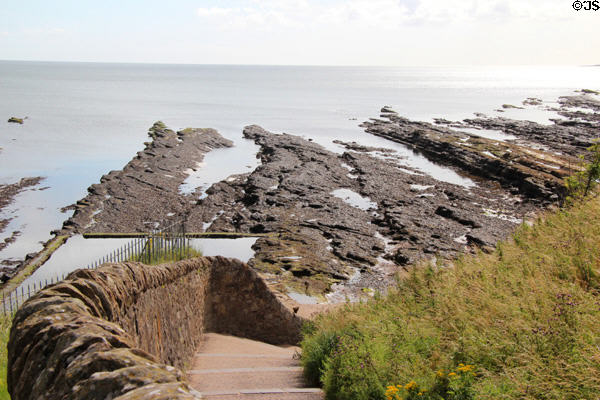 View of rocky shoreline from St Andrews Castle. St Andrews, Scotland.