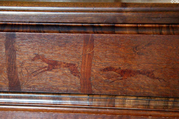 Detail of stag & hunting dog on chest of drawers by Robert Lorimer made by Whyttock & Reid at Kellie Castle. Pittenweem, Scotland.