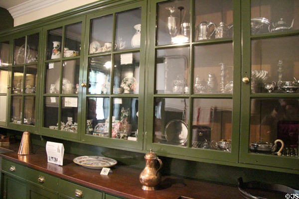 Pantry shelves with ceramics & silver at Hill of Tarvit Mansion. Cupar, Scotland.