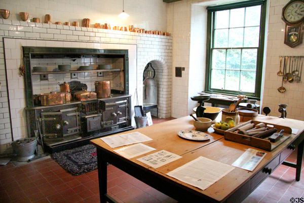 Kitchen with cast-iron range & copper vessels at Hill of Tarvit Mansion. Cupar, Scotland.